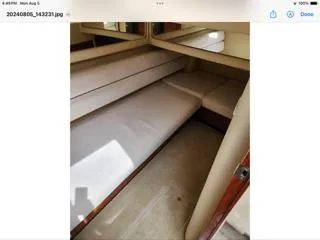  Yacht Photos Pics Interior cabin of 2004 Sea Ray 480 Sedan Bridge yacht with beige seating.