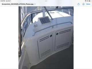  Yacht Photos Pics 2004 Sea Ray 480 Sedan Bridge yacht interior with sleek white cabinetry and railing.