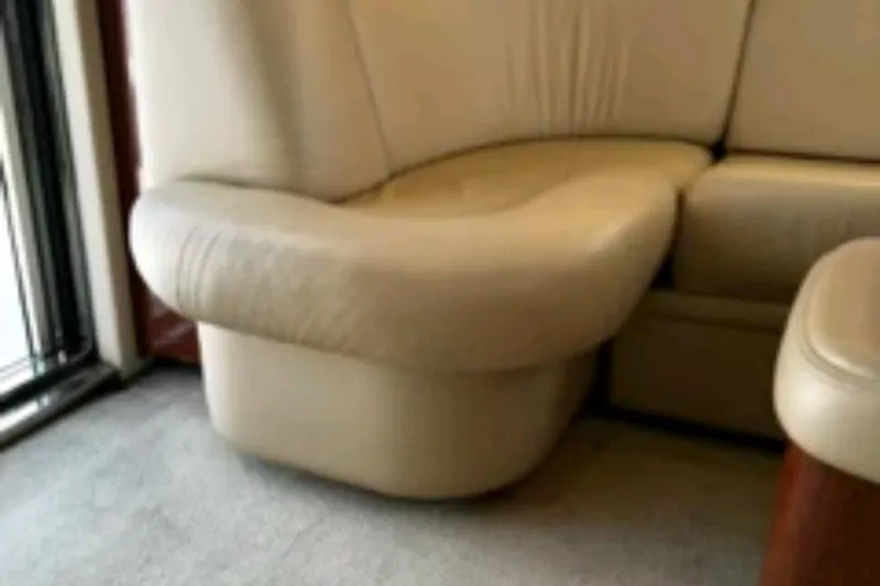  Yacht Photos Pics Cream leather seating in 2004 Sea Ray 480 Sedan Bridge yacht interior.