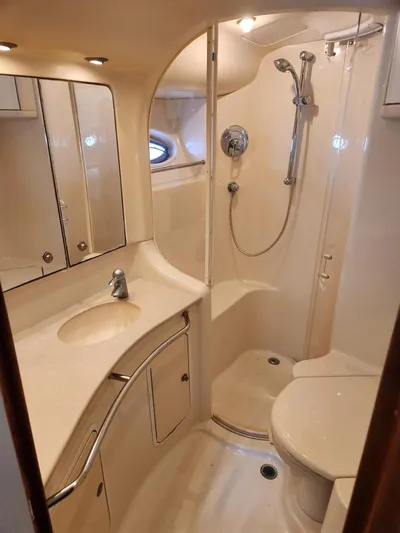  Yacht Photos Pics Luxurious bathroom in 2004 Sea Ray 480 Sedan Bridge yacht with shower and vanity.