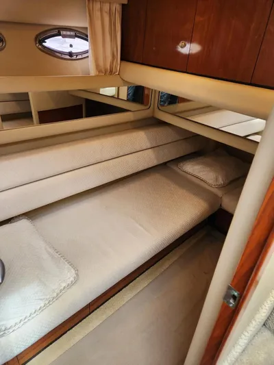  Yacht Photos Pics Interior cabin of 2004 Sea Ray 480 Sedan Bridge with cozy twin beds.