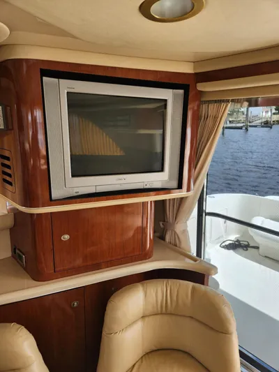 Yacht Photos Pics Interior of 2004 Sea Ray 480 Sedan Bridge with TV and leather seating.