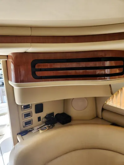  Yacht Photos Pics Interior of a 2004 Sea Ray 480 Sedan Bridge yacht, featuring luxurious seating and wood paneling.
