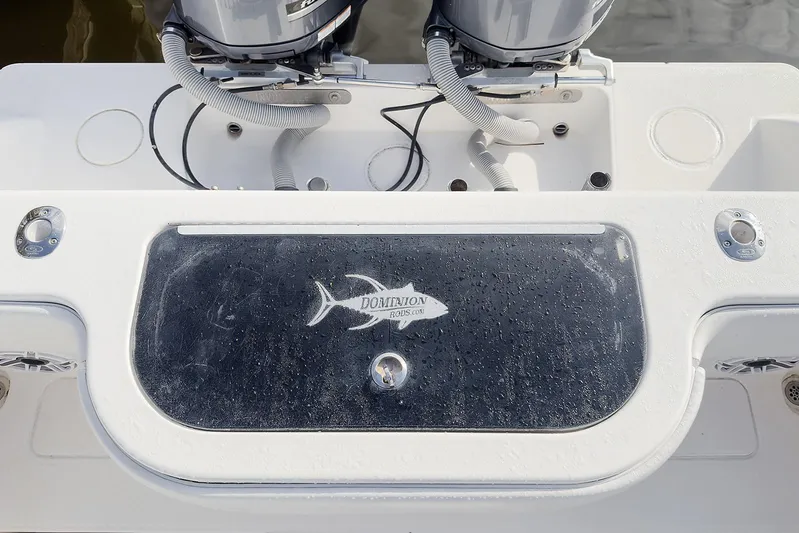 Dominion Yacht Photos Pics 2007 Invincible 33 Open Fisherman boat deck with dual engines and logo.