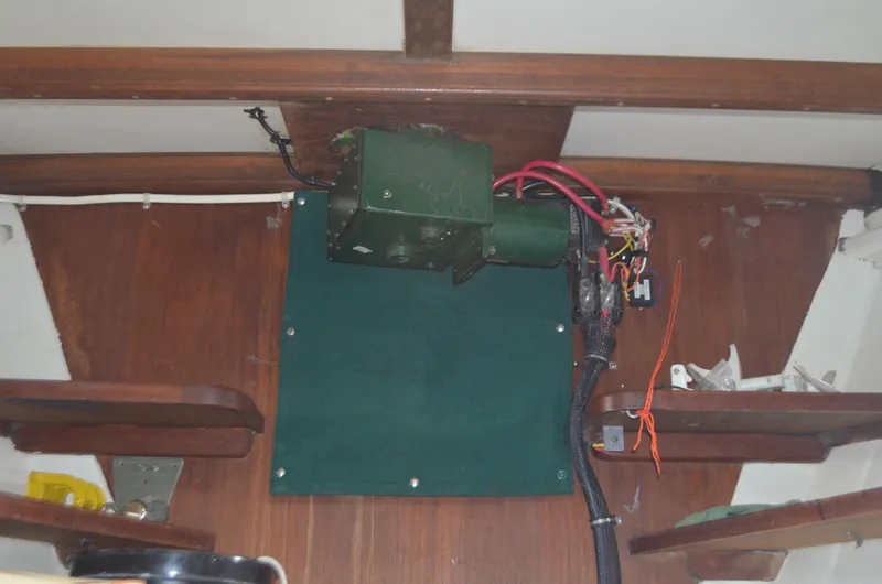 Drakus Yacht Photos Pics Interior view of a 1973 Skookum Ketch sailboat showing electrical wiring and wooden paneling.