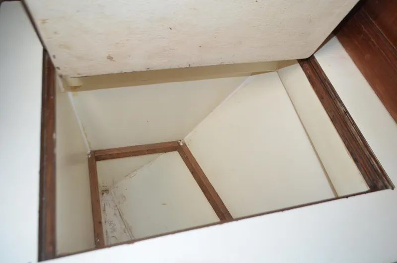 Drakus Yacht Photos Pics Open storage compartment on 1973 Skookum Ketch boat, showcasing interior space.