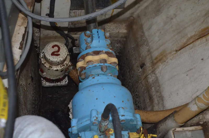 Drakus Yacht Photos Pics Engine room of 1973 Skookum Ketch with blue machinery and numbered valve.