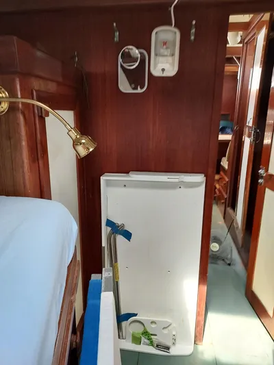 Drakus Yacht Photos Pics Interior of 1973 Skookum Ketch sailboat with wooden paneling and nautical decor.