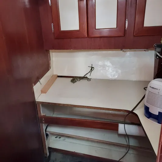 Drakus Yacht Photos Pics 1973 Skookum Ketch interior with wooden cabinets and countertop.