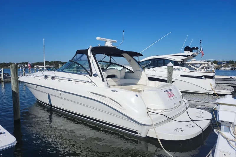  Yacht Photos Pics 2002 Sea Ray 410 Sundancer yacht docked at marina under clear blue sky.