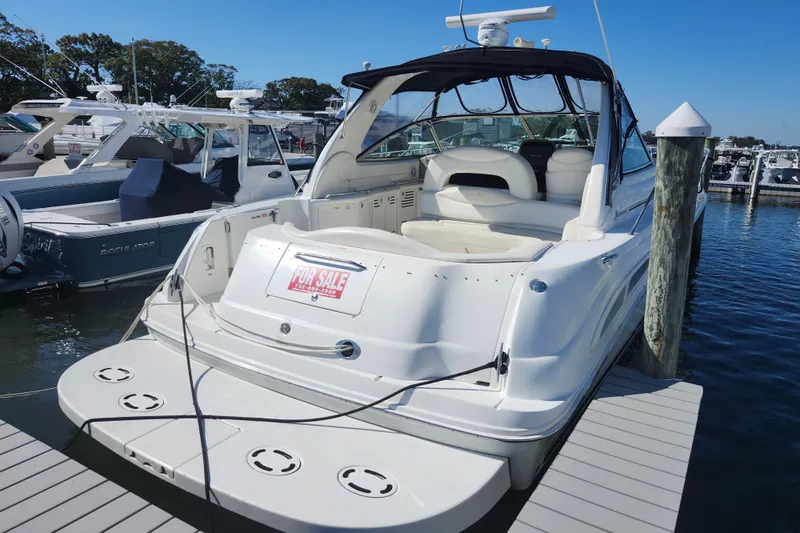  Yacht Photos Pics 2002 Sea Ray 410 Sundancer yacht docked, for sale sign visible, sunny marina setting.