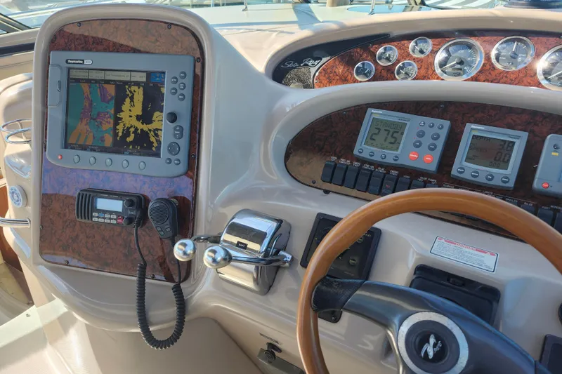  Yacht Photos Pics Control panel of a 2002 Sea Ray 410 Sundancer boat with navigation equipment.