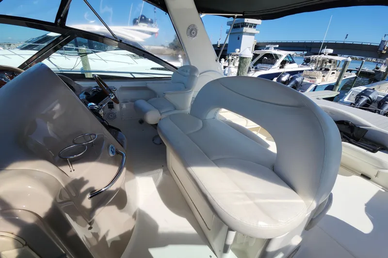  Yacht Photos Pics Interior of 2002 Sea Ray 410 Sundancer yacht with plush seating and helm station.