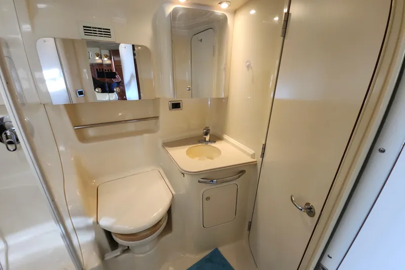  Yacht Photos Pics Luxurious bathroom in 2002 Sea Ray 410 Sundancer yacht, featuring modern amenities.