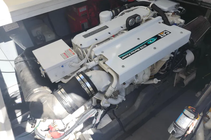  Yacht Photos Pics Engine compartment of a 2002 Sea Ray 410 Sundancer boat, featuring a powerful marine engine.