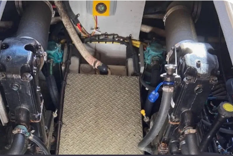  Yacht Photos Pics Engine compartment of a 2007 Meridian 341 Sedan boat, showing mechanical components and hoses.