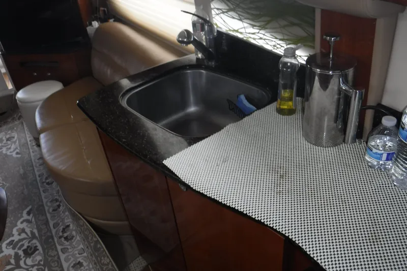  Yacht Photos Pics 2007 Meridian 341 Sedan interior with kitchen sink and countertop accessories.