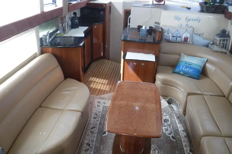  Yacht Photos Pics Luxurious interior of a 2007 Meridian 341 Sedan yacht with leather seating and kitchenette.