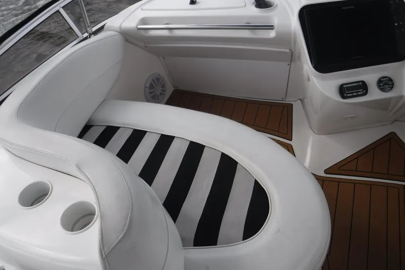  Yacht Photos Pics 2007 Meridian 341 Sedan interior with white seating and striped cushion.