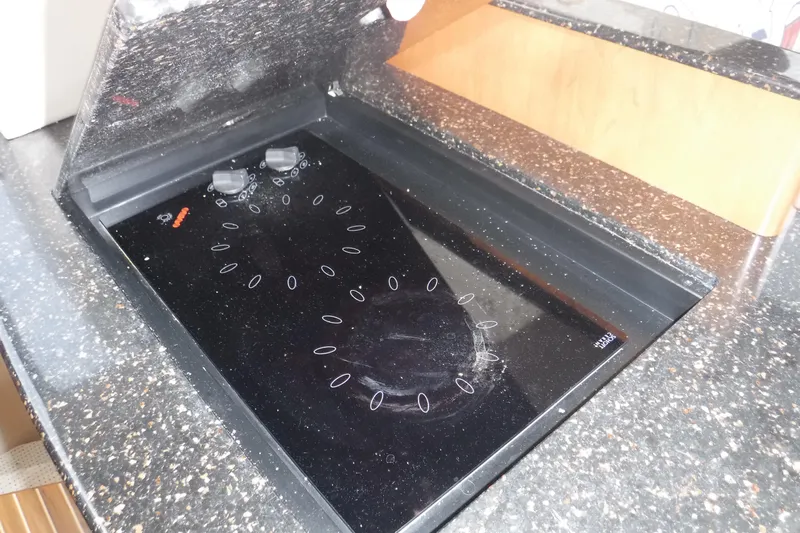  Yacht Photos Pics 2007 Meridian 341 Sedan kitchen with sleek black electric cooktop.