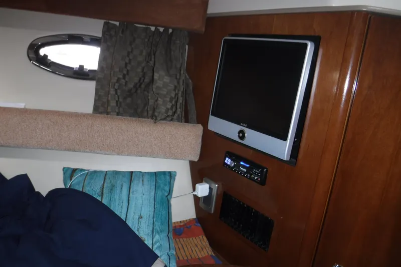  Yacht Photos Pics Interior of 2007 Meridian 341 Sedan with TV, stereo, and porthole window.