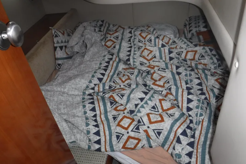  Yacht Photos Pics Cozy cabin bed with patterned bedding in 2007 Meridian 341 Sedan yacht.