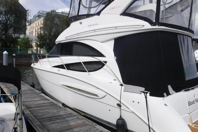  Yacht Photos Pics 2007 Meridian 341 Sedan yacht docked at a marina, featuring sleek design and modern architecture.