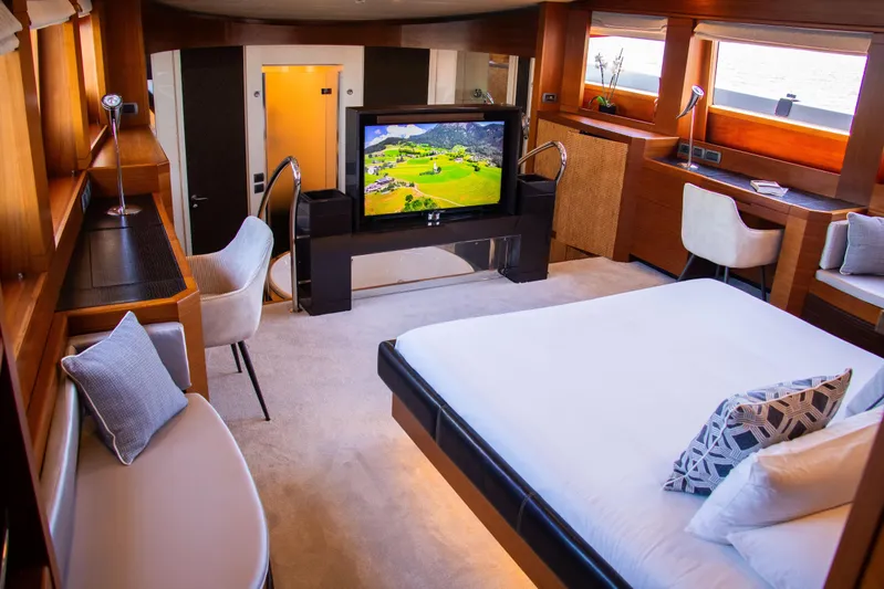 Matsu Yacht Photos Pics Luxurious bedroom interior of 2009 ISA 120 Sport yacht with modern decor and large TV.