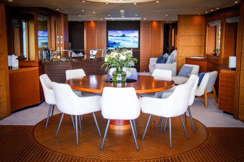 Matsu Yacht Photos Pics Luxurious interior of 2009 ISA 120 Sport yacht with elegant dining area and modern decor.