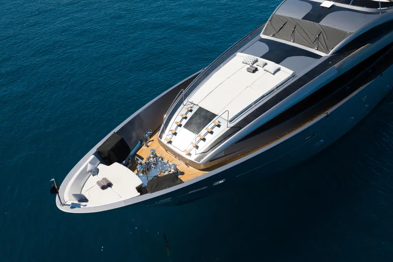 Matsu Yacht Photos Pics Luxury 2009 ISA 120 Sport yacht on calm blue sea, aerial view.