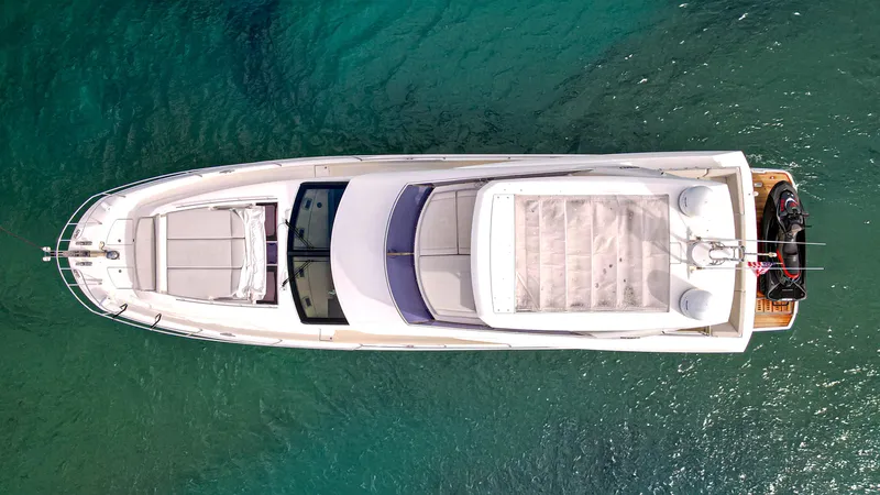 Yachtooma Yacht Photos Pics Aerial view of 2017 Present Yachts 680 on clear blue water.