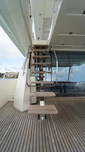 Yachtooma Yacht Photos Pics Staircase on 2017 Present Yachts 680, featuring sleek design and wooden deck.