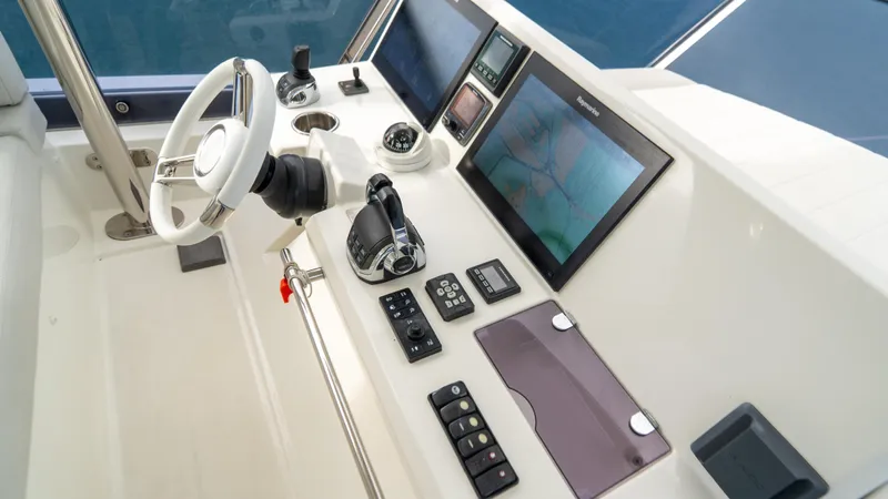 Yachtooma Yacht Photos Pics Cockpit of 2017 Present Yachts 680 with navigation screens and controls.