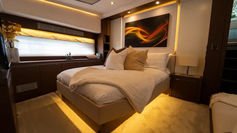 Yachtooma Yacht Photos Pics Luxurious bedroom interior of 2017 Present Yachts 680, featuring modern decor and ambient lighting.
