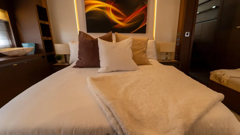 Yachtooma Yacht Photos Pics Luxurious bedroom interior on 2017 Present Yachts 680, featuring elegant bedding and modern decor.
