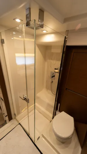 Yachtooma Yacht Photos Pics Luxurious bathroom in 2017 Present Yachts 680 with glass shower and modern fixtures.