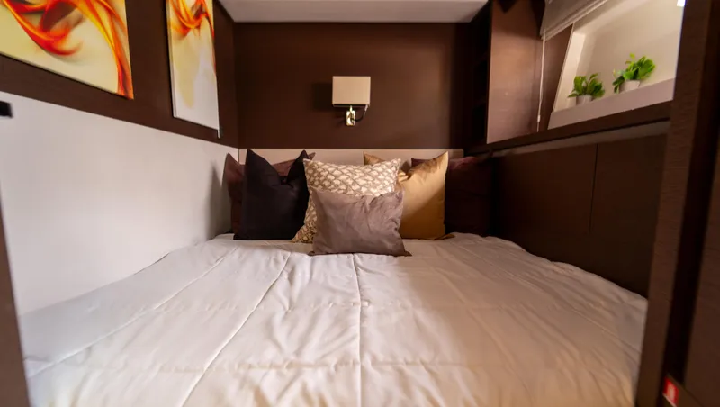 Yachtooma Yacht Photos Pics Luxurious bedroom interior of 2017 Present Yachts 680 with cozy bedding and modern decor.