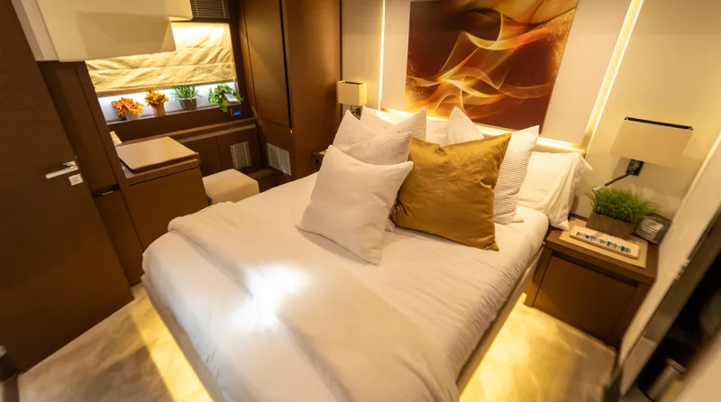 Yachtooma Yacht Photos Pics Luxurious bedroom interior of 2017 Present Yachts 680 with elegant decor and ambient lighting.