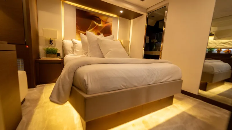 Yachtooma Yacht Photos Pics Luxurious bedroom interior of 2017 Present Yachts 680, featuring elegant lighting and modern decor.
