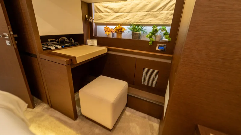 Yachtooma Yacht Photos Pics Luxurious interior of 2017 Present Yachts 680 with elegant wood finish and modern decor.