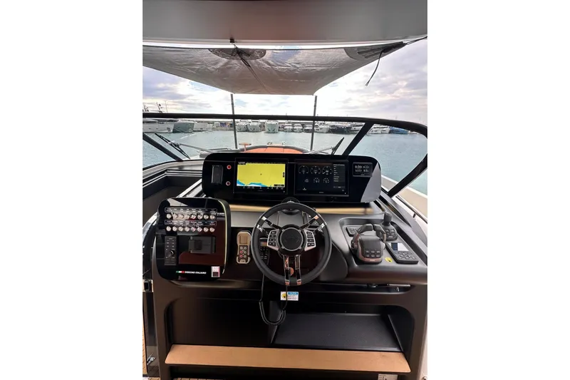  Yacht Photos Pics Cockpit of 2025 Cranchi A46 Luxury Tender with advanced navigation controls and displays.