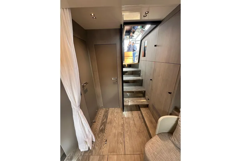  Yacht Photos Pics Interior of 2025 Cranchi A46 Luxury Tender with modern wood finish and staircase.