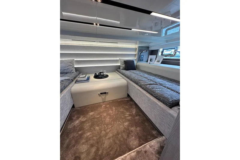  Yacht Photos Pics Luxurious interior of 2025 Cranchi A46 Luxury Tender with twin beds and modern decor.