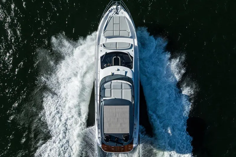 Bg 53 Yacht Photos Pics Aerial view of 2024 Azimut 53 Fly yacht cruising on water.