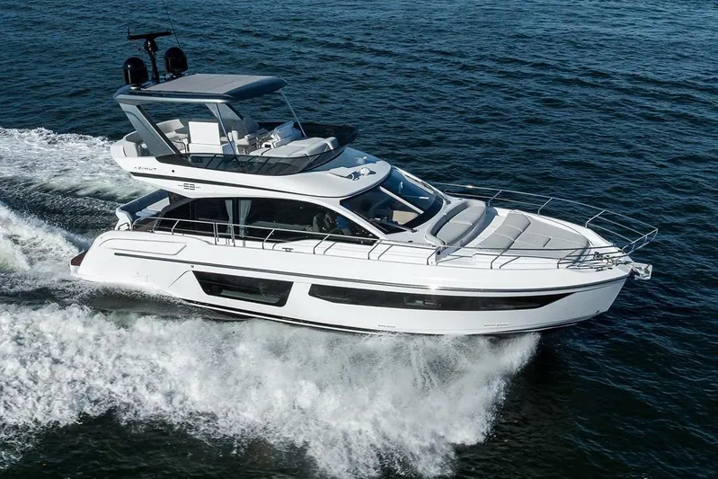 Bg 53 Yacht Photos Pics 2024 Azimut 53 Fly yacht cruising on open water, showcasing sleek design and luxury features.