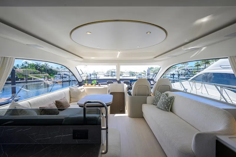 Bg 53 Yacht Photos Pics Luxurious interior of 2024 Azimut 53 Fly yacht with elegant seating and panoramic windows.
