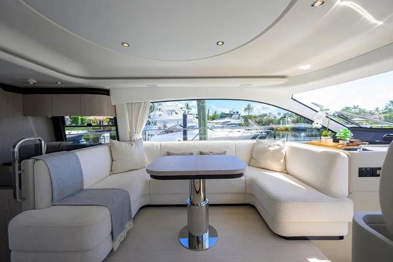 Bg 53 Yacht Photos Pics Luxurious interior of 2024 Azimut 53 Fly yacht with elegant seating and panoramic windows.