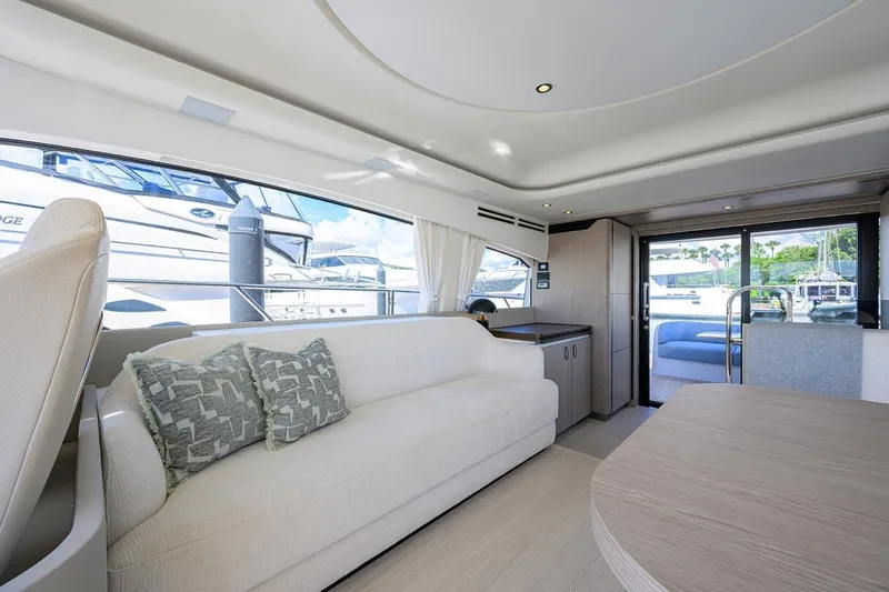 Bg 53 Yacht Photos Pics Luxurious interior of 2024 Azimut 53 Fly yacht with elegant seating and large windows.