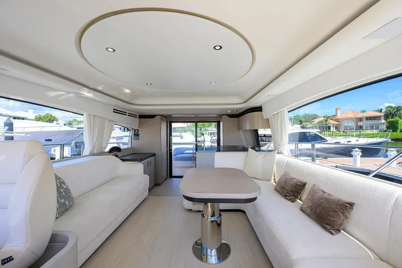 Bg 53 Yacht Photos Pics Luxurious interior of 2024 Azimut 53 Fly yacht with elegant seating and panoramic windows.