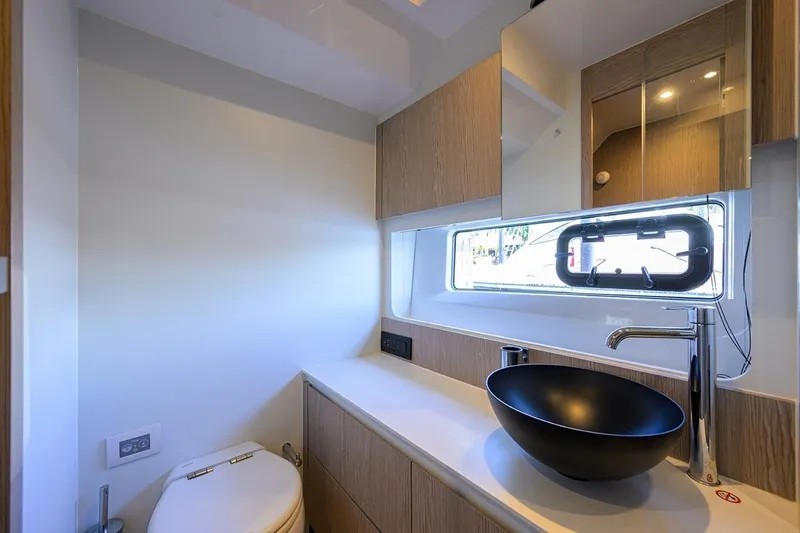 Bg 53 Yacht Photos Pics Luxurious bathroom interior of 2024 Azimut 53 Fly yacht with modern fixtures.